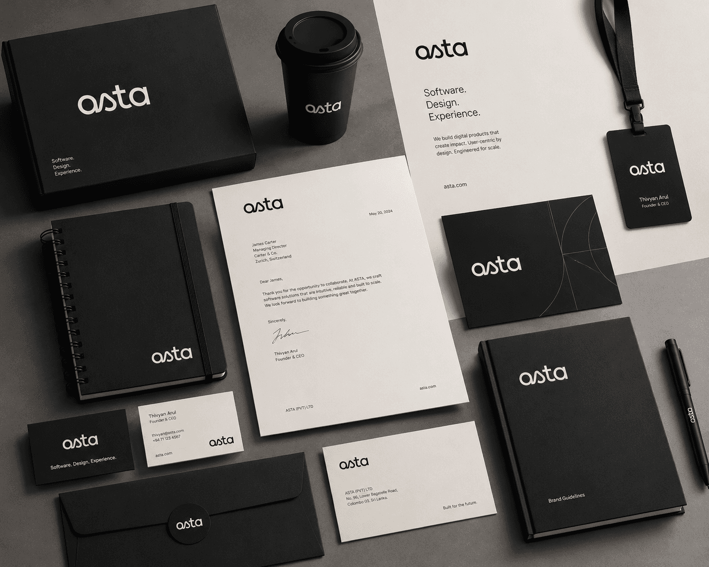 The Asta identity across a presentation box, notebooks, letterhead, the brand guidelines book, a lanyard, business cards, envelopes and a branded cup